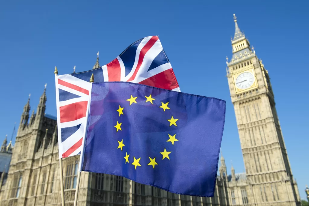 Westminster Abbey with UK and EU flags