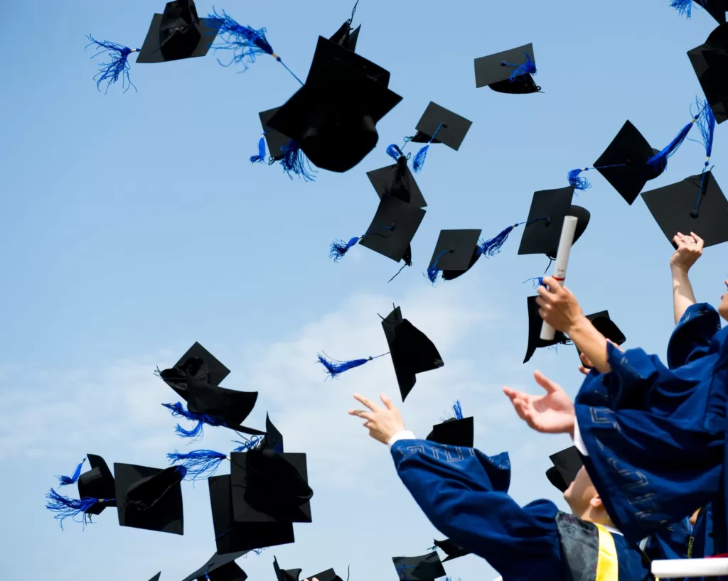 graduation hats in the air