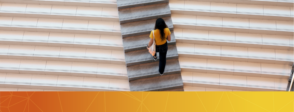 A student walking up stairs