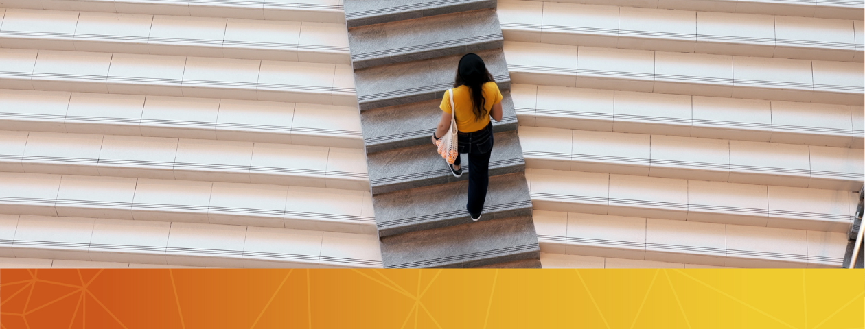 A student walking up stairs