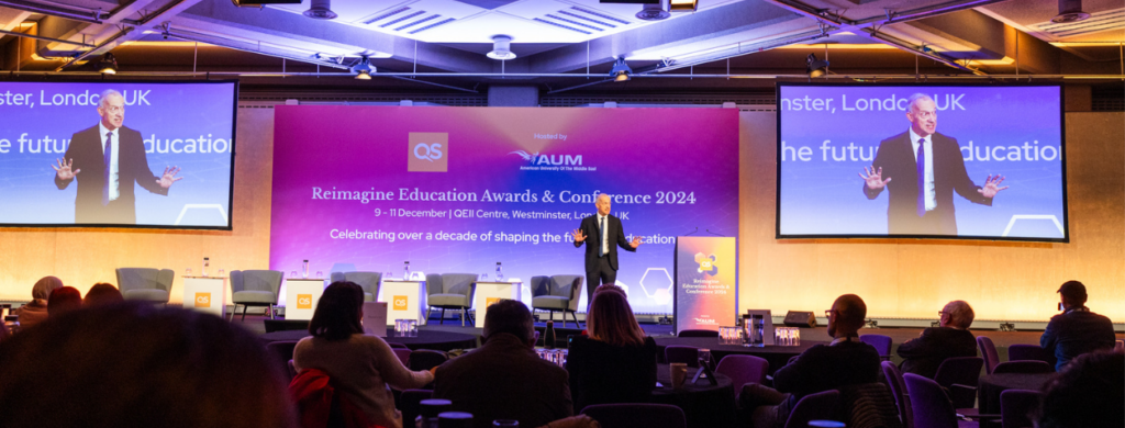 Dr Michael Spence, President and Provost of UCL on stage at QS Reimagine Education